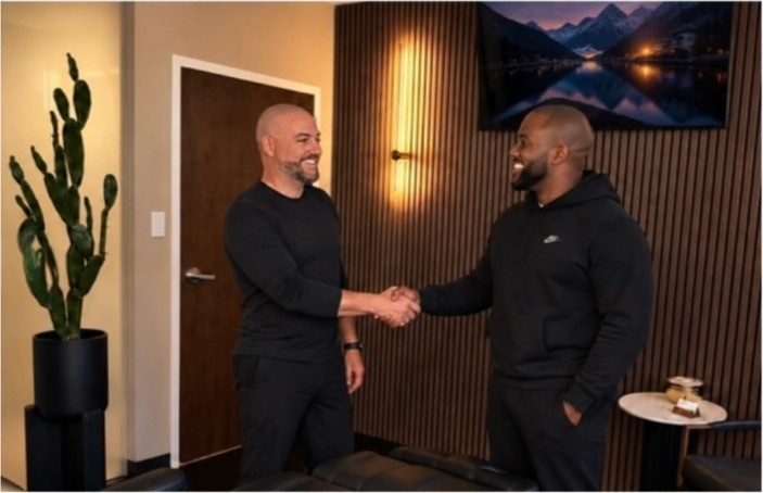 Justin Chamberland greeting a client in the Scalpworx studio